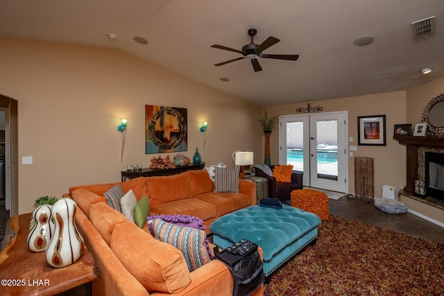 living area featuring vaulted ceiling, ceiling fan, french doors, finished concrete flooring, and visible vents