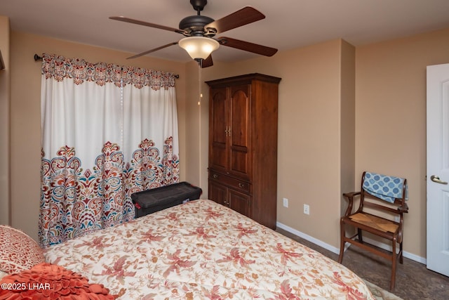 bedroom with a ceiling fan and baseboards