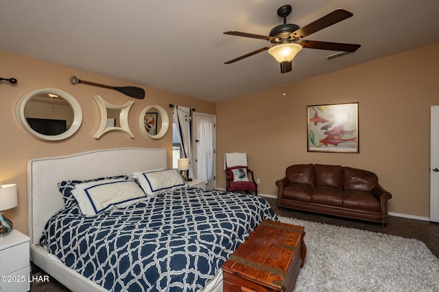 carpeted bedroom with vaulted ceiling, visible vents, baseboards, and ceiling fan
