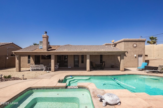 view of swimming pool with french doors, fence, a patio, a fenced in pool, and an in ground hot tub