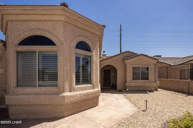 view of front of house featuring stucco siding