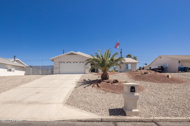 ranch-style house with fence, driveway, stucco siding, and a garage