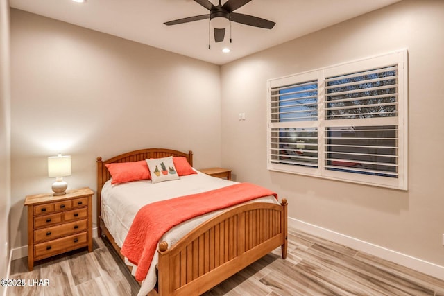 bedroom with recessed lighting, ceiling fan, baseboards, and wood finished floors