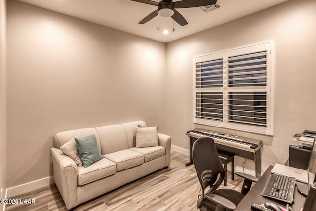 office featuring light wood finished floors, recessed lighting, visible vents, ceiling fan, and baseboards