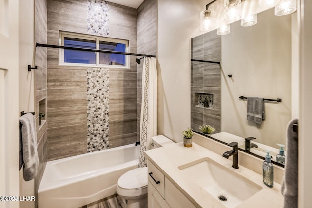 bathroom with shower / tub combo, vanity, and toilet