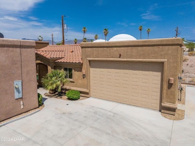 adobe home featuring a garage