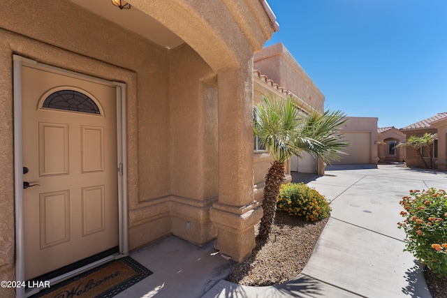 property entrance with a garage