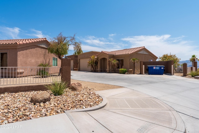 mediterranean / spanish-style home with a garage