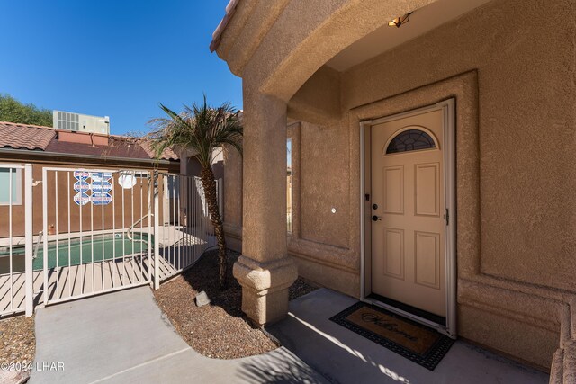 property entrance with central AC unit