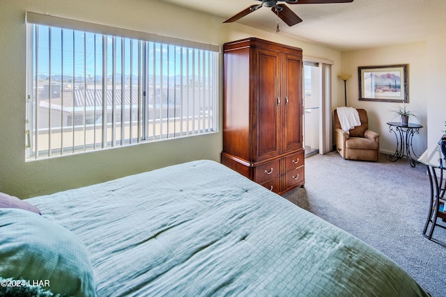 bedroom featuring carpet flooring, ceiling fan, a view of the beach, and a water view