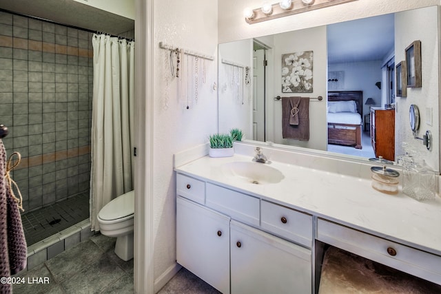 bathroom with tile patterned floors, vanity, toilet, and curtained shower