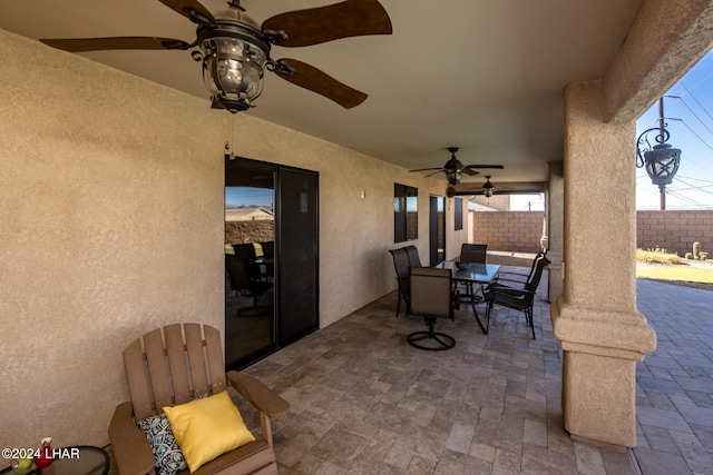 view of patio featuring ceiling fan