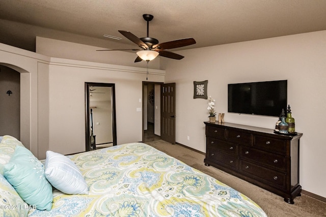 carpeted bedroom with ceiling fan