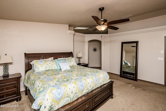 bedroom featuring light carpet and ceiling fan