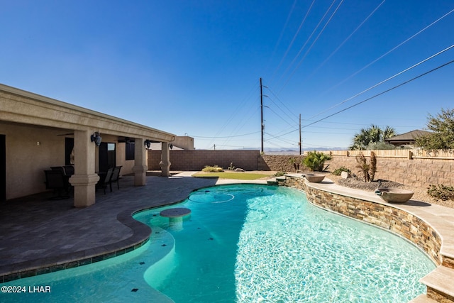 view of swimming pool featuring a patio area