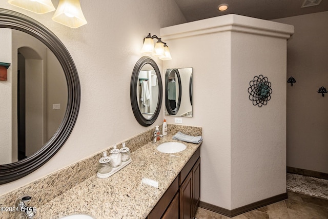 bathroom with vanity and tile patterned flooring