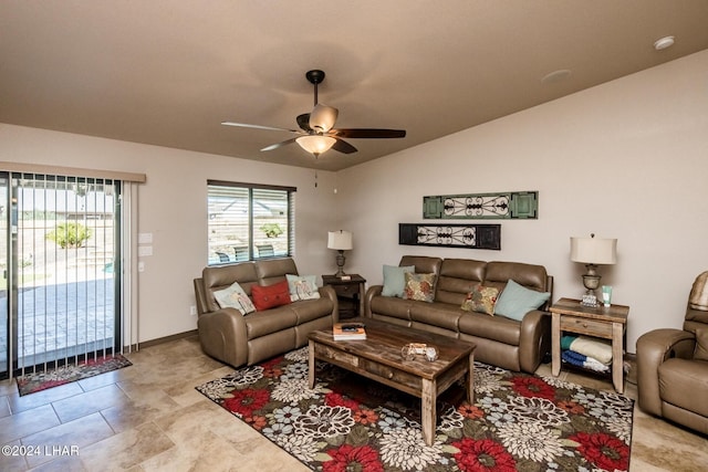 living room featuring vaulted ceiling, light tile patterned flooring, and ceiling fan