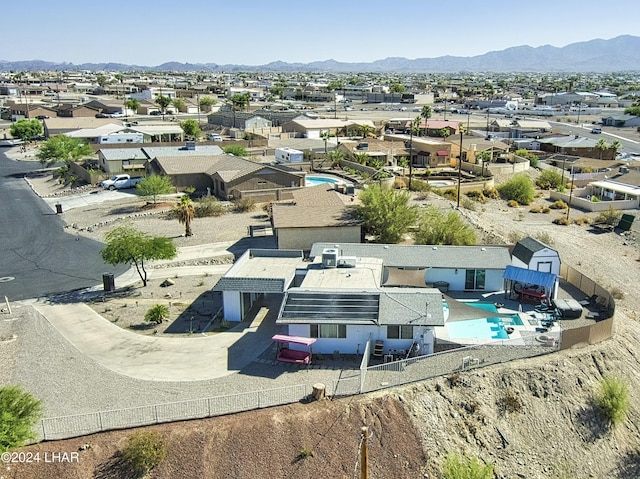 birds eye view of property featuring a mountain view