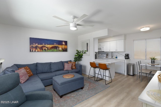 2100 Swanson Ave Unit 209, Lake Havasu City, AZ 86403 - living area featuring light wood-style flooring and a ceiling fan