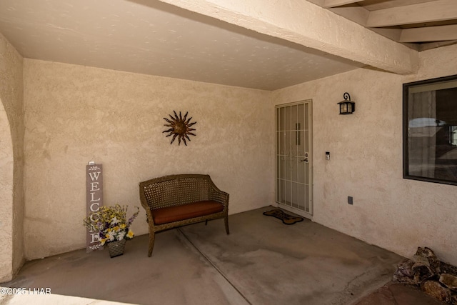 entrance to property featuring a patio area