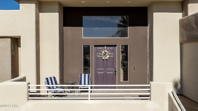 doorway to property featuring a balcony