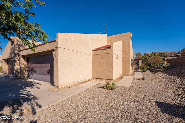 view of property exterior with a garage