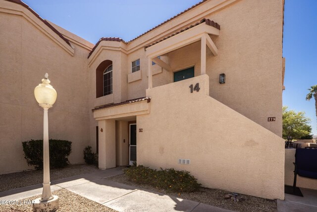 1650 Smoketree Ave S Unit 175, Lake Havasu City, AZ 86403 - exterior space with stucco siding and a tile roof