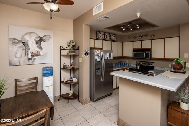 1650 Smoketree Ave S Unit 175, Lake Havasu City, AZ 86403 - kitchen with visible vents, light countertops, appliances with stainless steel finishes, and a peninsula