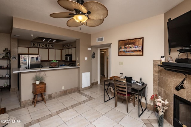 1650 Smoketree Ave S Unit 175, Lake Havasu City, AZ 86403 - dining area with visible vents, ceiling fan, a tile fireplace, and light tile patterned floors