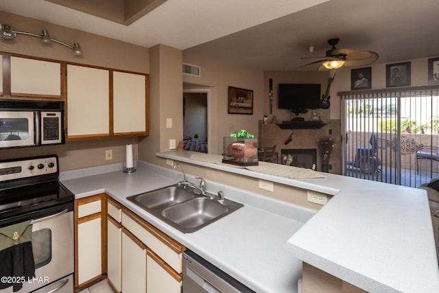 1650 Smoketree Ave S Unit 175, Lake Havasu City, AZ 86403 - kitchen with light countertops, a ceiling fan, visible vents, stainless steel appliances, and a sink