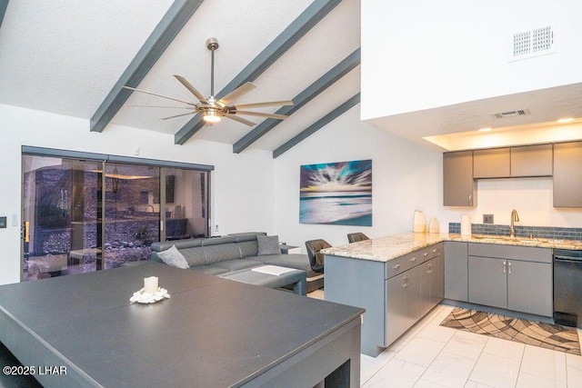 kitchen with vaulted ceiling with beams, gray cabinetry, a peninsula, a sink, and marble finish floor