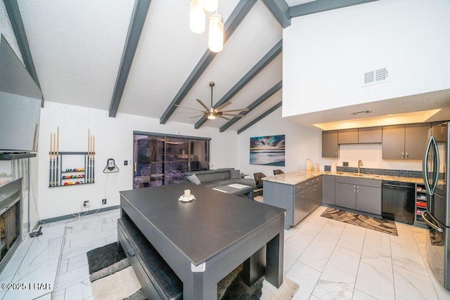 dining area featuring marble finish floor, ceiling fan, visible vents, and beam ceiling