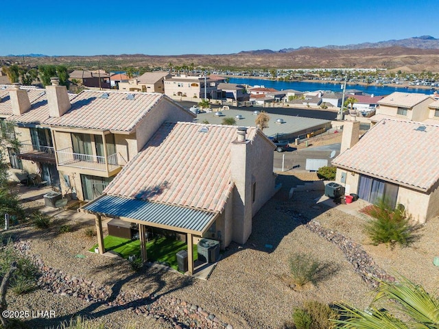 birds eye view of property with a residential view and a water and mountain view