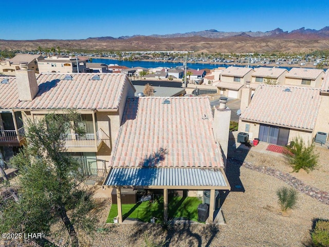 birds eye view of property with a residential view and a mountain view