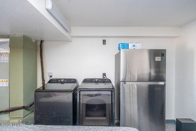 washroom with laundry area and washing machine and dryer