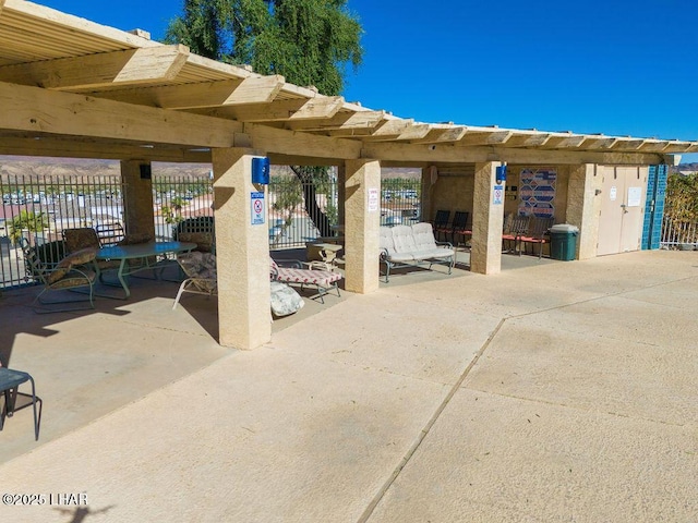 view of patio / terrace featuring fence