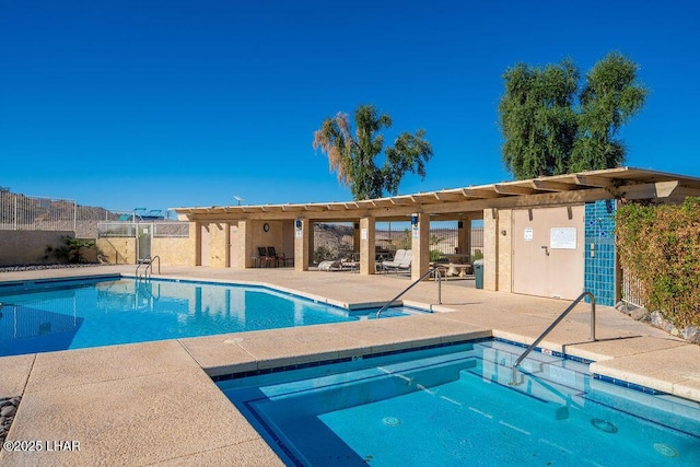 pool featuring a hot tub, a patio area, fence, and a pergola