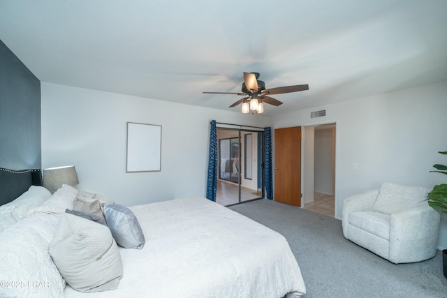 bedroom featuring carpet floors, ceiling fan, and visible vents