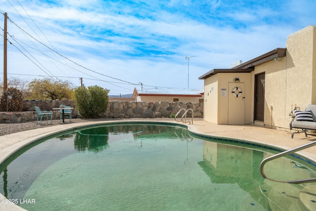 view of swimming pool with a fenced in pool, a patio area, and a fenced backyard