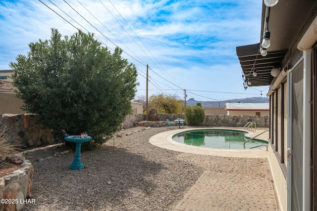 view of swimming pool featuring a fenced in pool, a patio area, and a fenced backyard