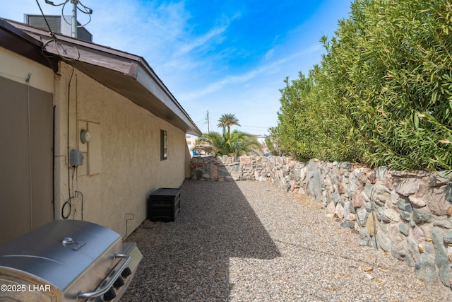 view of side of property with stucco siding