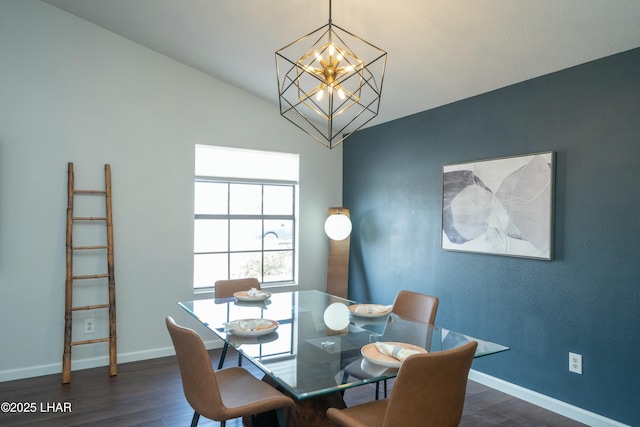 dining space with an inviting chandelier, baseboards, and dark wood-type flooring