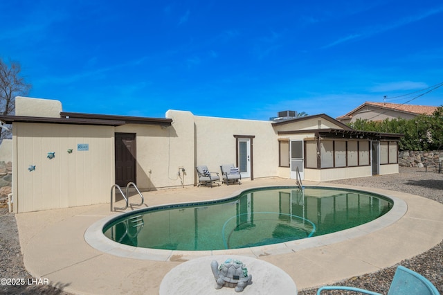 view of pool with a fenced in pool and a patio