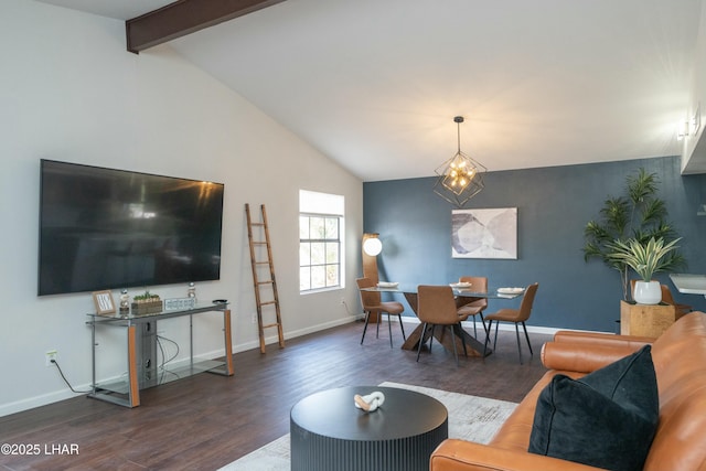 living area with vaulted ceiling with beams, wood finished floors, and baseboards