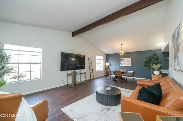 living room with vaulted ceiling with beams, a notable chandelier, baseboards, and wood finished floors