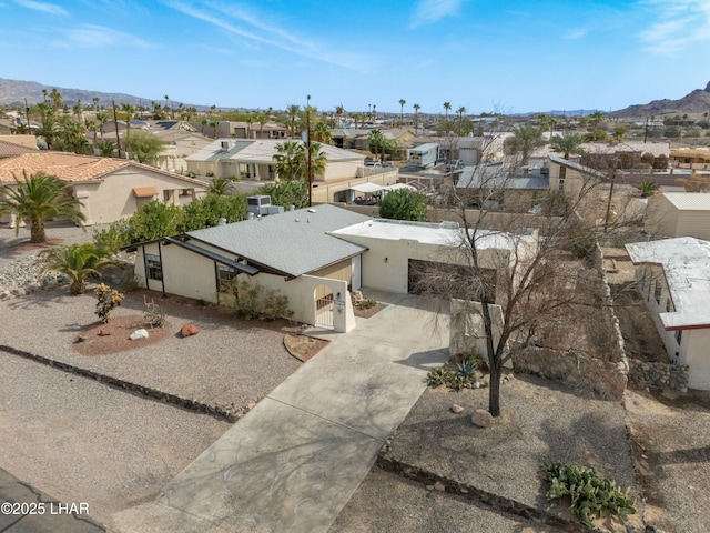 bird's eye view featuring a residential view and a mountain view