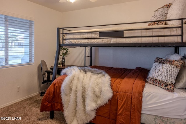 carpeted bedroom with baseboards