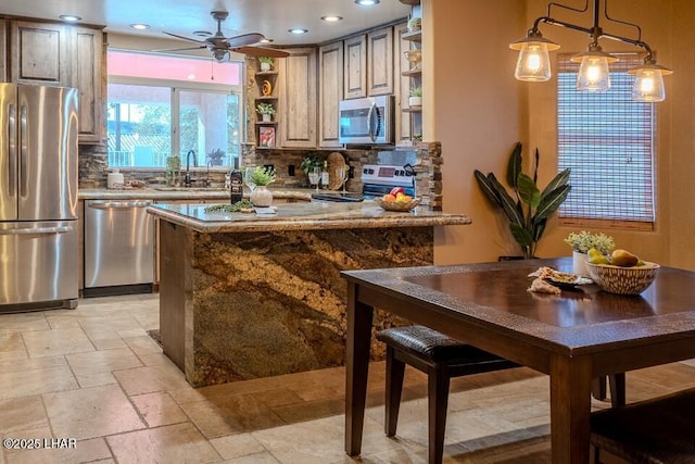 kitchen with stone tile floors, decorative backsplash, decorative light fixtures, stainless steel appliances, and open shelves