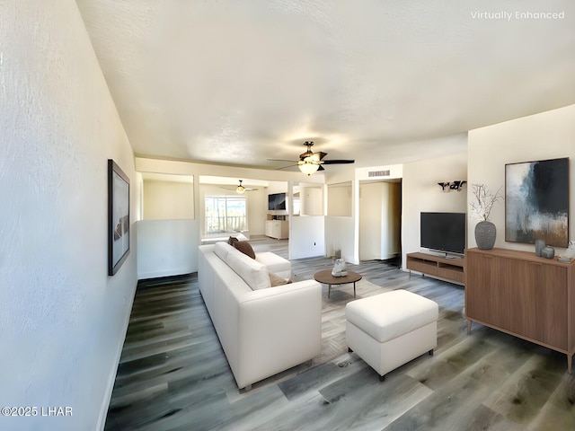 living room with ceiling fan and hardwood / wood-style floors