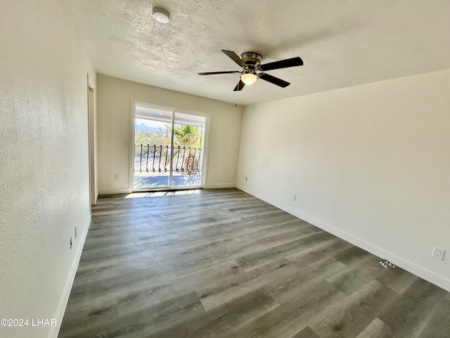 unfurnished room with ceiling fan, hardwood / wood-style flooring, and a textured ceiling